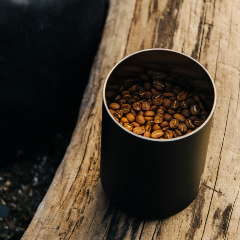 MiiR Airlock Coffee Canister holding coffee beans